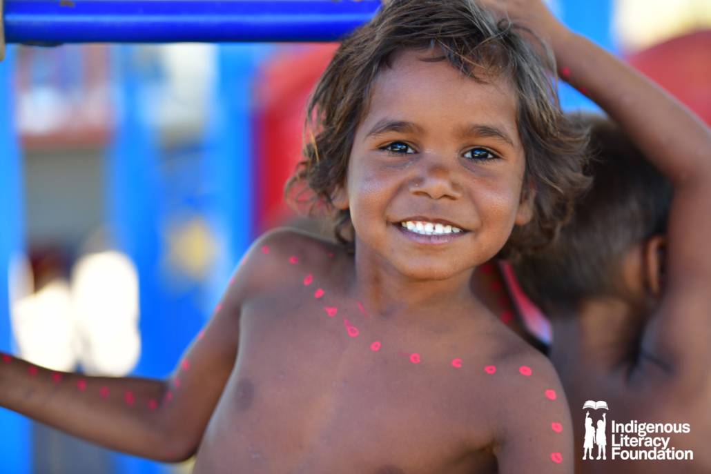 Image of aboriginal boy smiling towards the camera