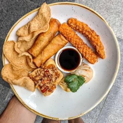 A white plate of P'Nut's side dishes